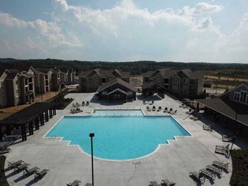 a large swimming pool in front of a building at The Venue at 109 Apartments , Tennessee